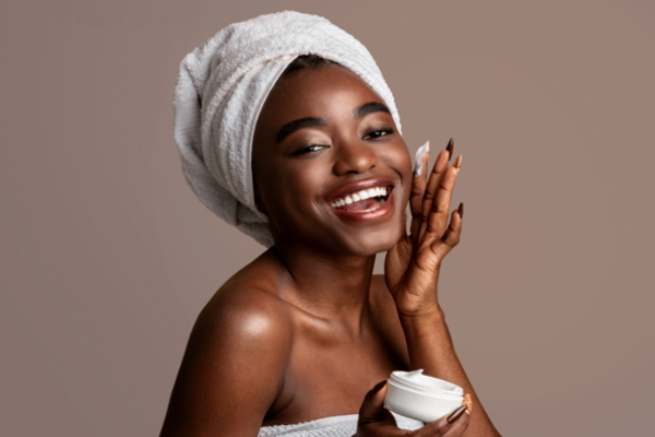 woman applying moisturizer