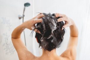 woman washing hair in shower