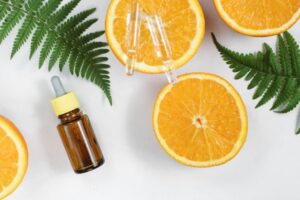 bottle of serum with citrus fruits